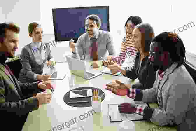 A Group Of Colleagues Brainstorming Ideas In A Meeting Room The Housing Design Handbook: A Guide To Good Practice